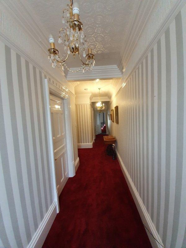Striped wallpaper with a red carpet - hallway, stairs and landing project